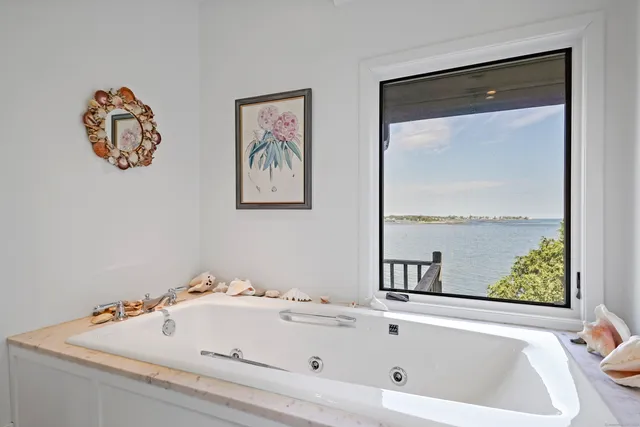 a bedroom with a bed and a table