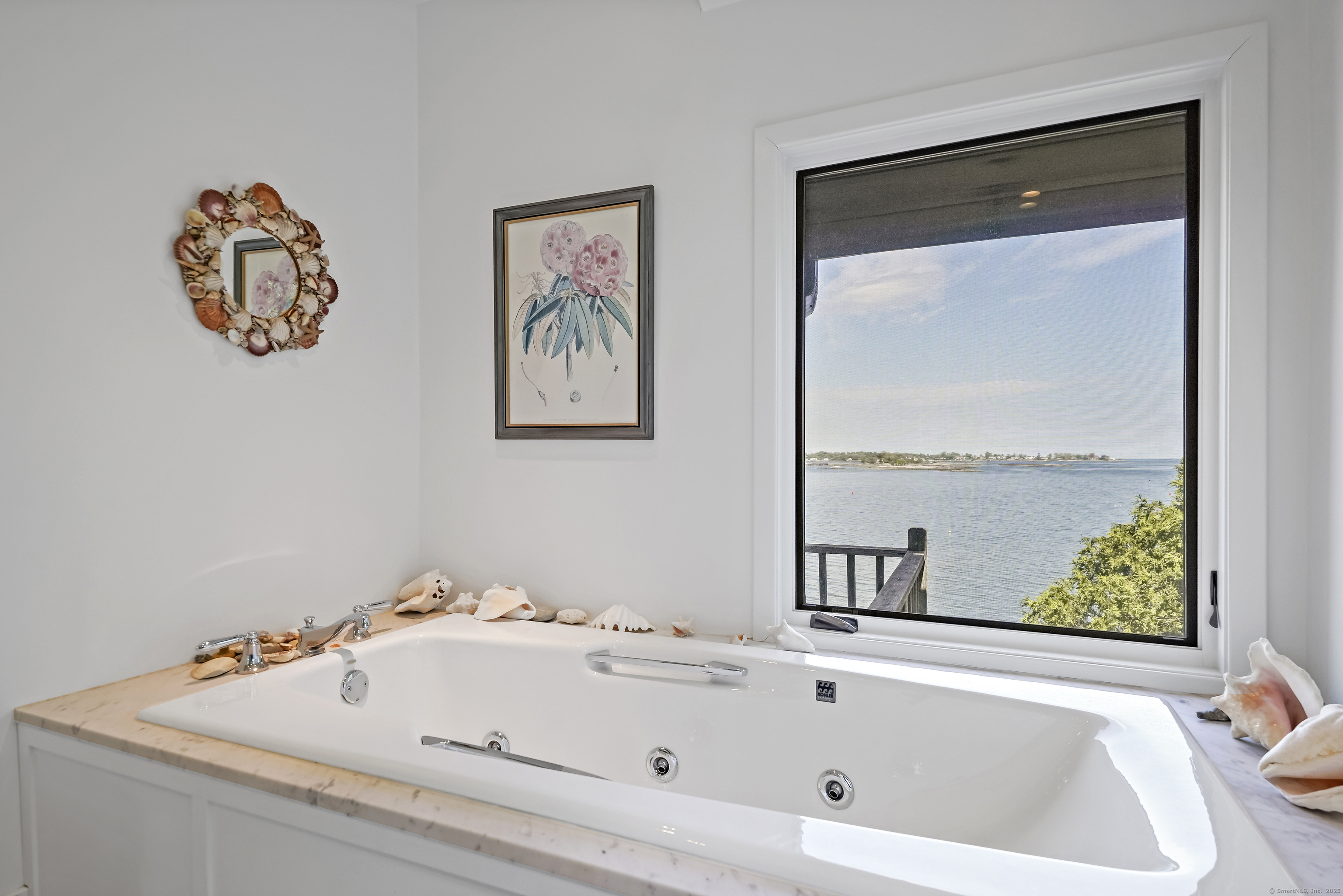 64 Ocean Drive East Stamford, CT 06902 - Photo 22 of 38 a bathroom with a tub and a window