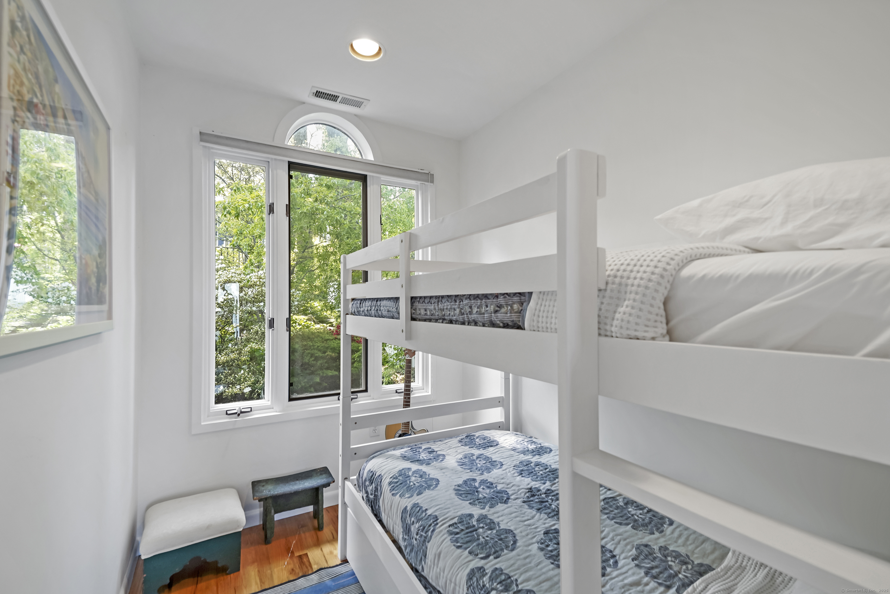 64 Ocean Drive East Stamford, CT 06902 - Photo 25 of 38 a bedroom with furniture and a large window