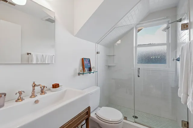 a living room with furniture and large windows