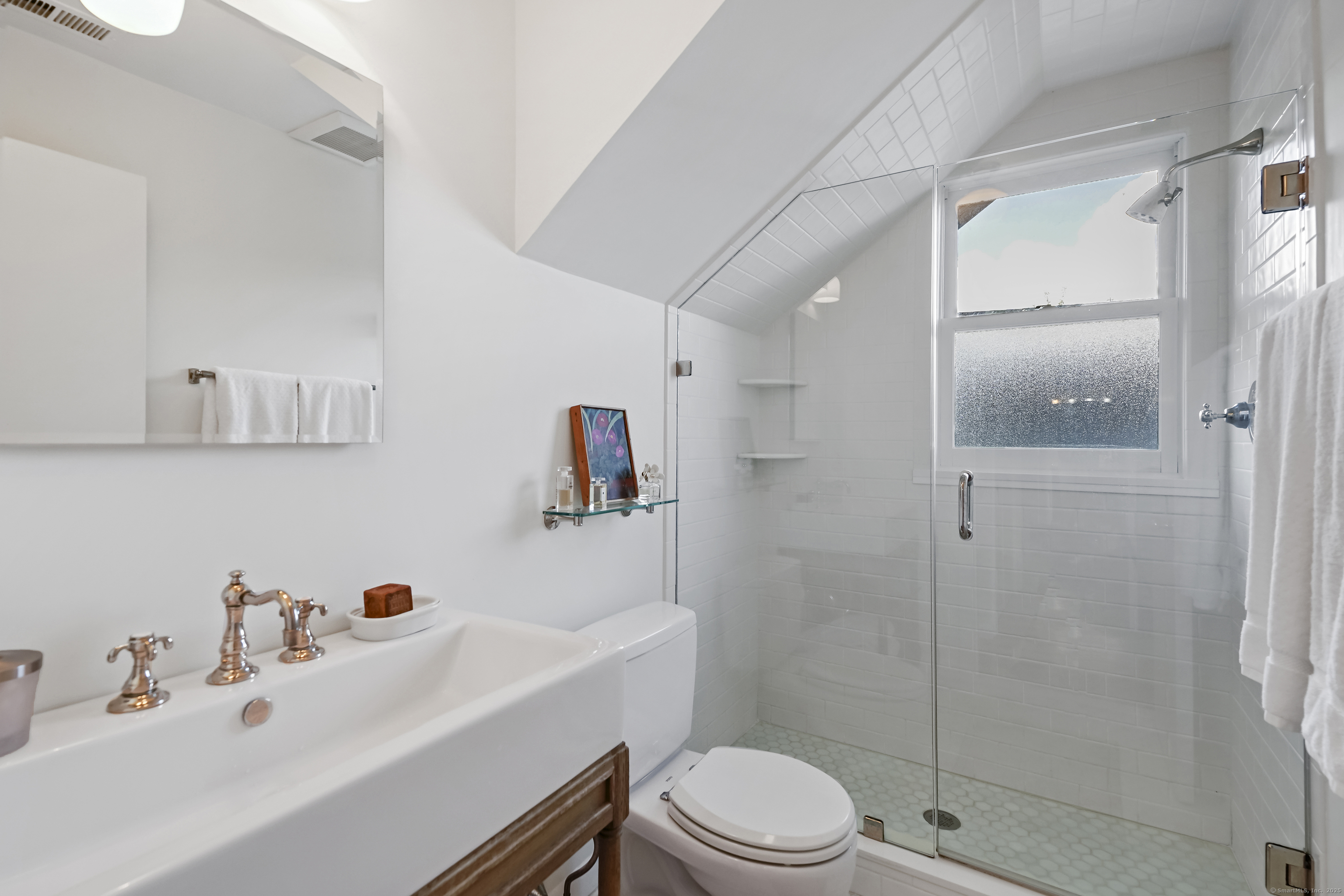 64 Ocean Drive East Stamford, CT 06902 - Photo 26 of 38 a bathroom with a sink toilet and shower