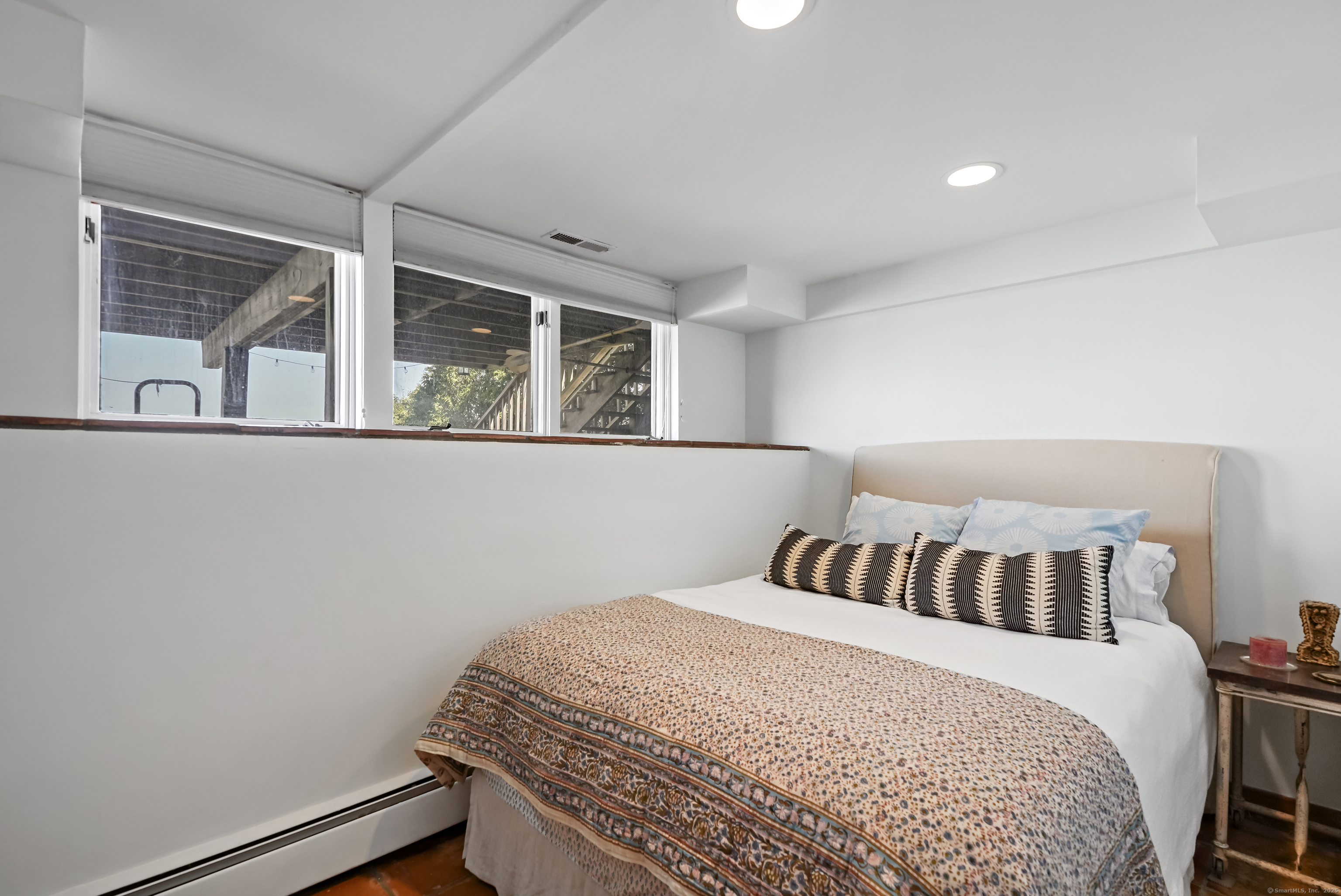 64 Ocean Drive East Stamford, CT 06902 - Photo 28 of 38 a bedroom with a bed and window