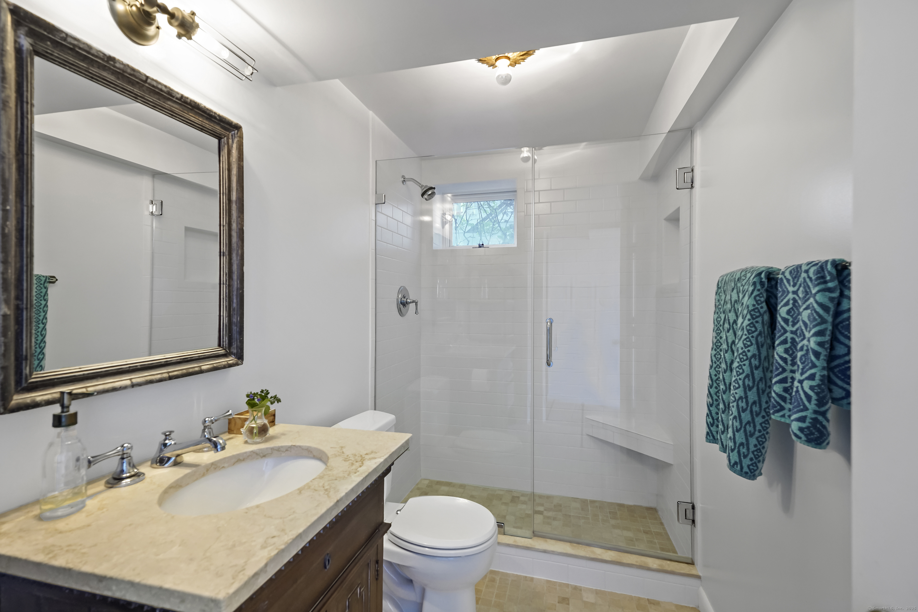 64 Ocean Drive East Stamford, CT 06902 - Photo 29 of 38 a bathroom with a sink toilet and shower