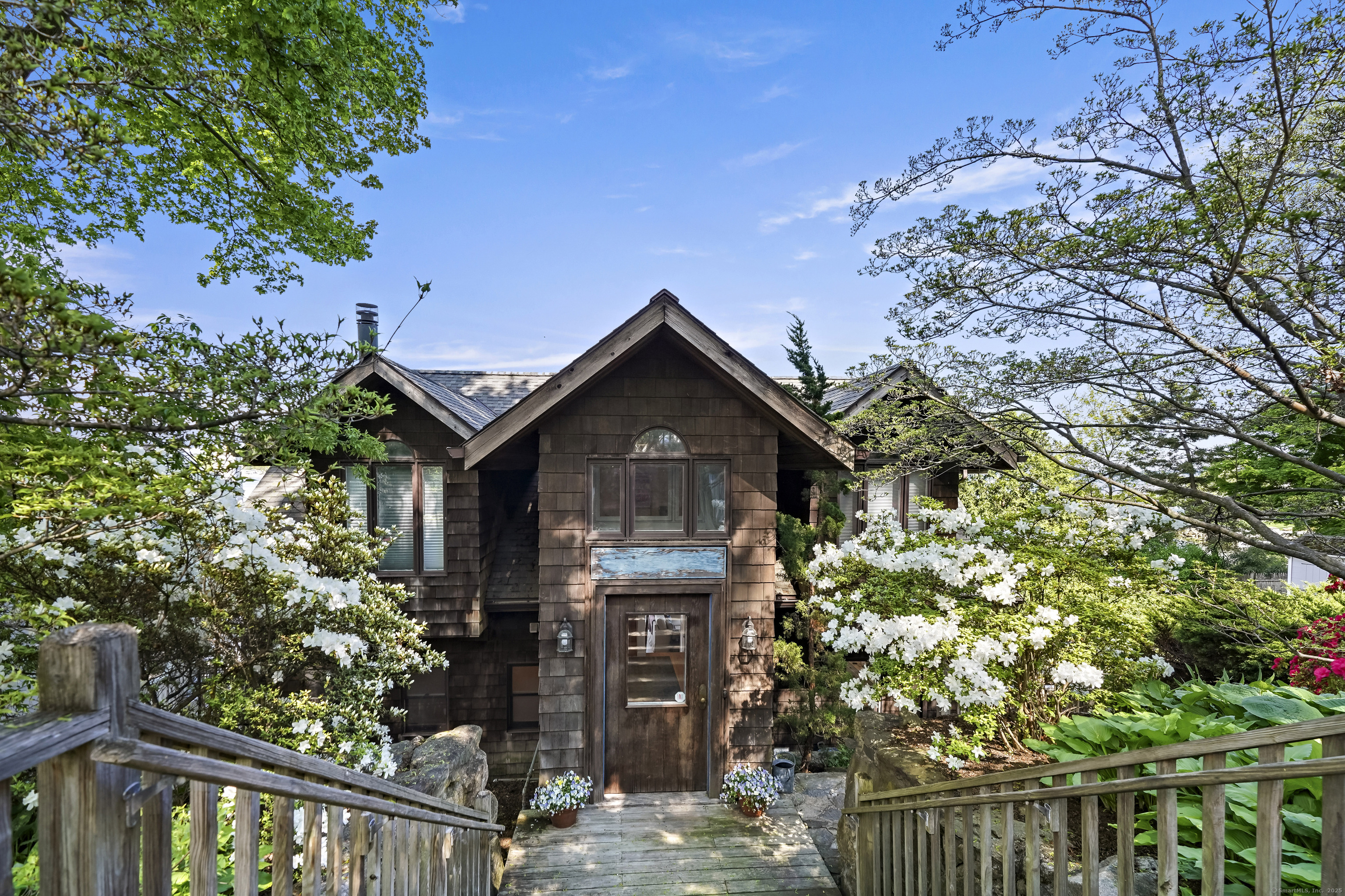 64 Ocean Drive East Stamford, CT 06902 - Photo 32 of 38 a front view of a house with a yard