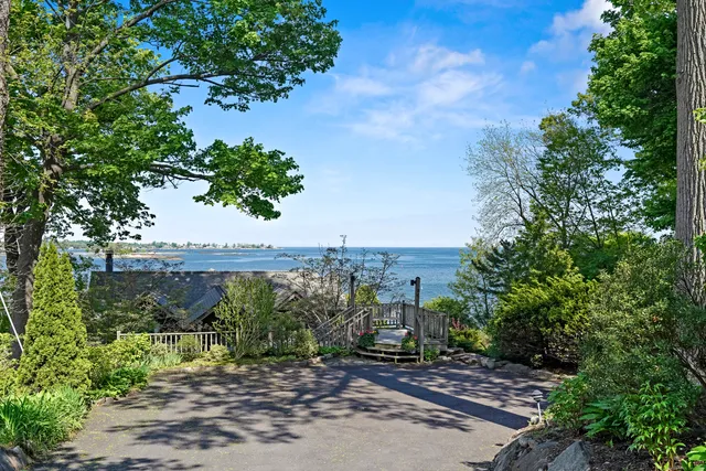 a pathway of a house with a yard