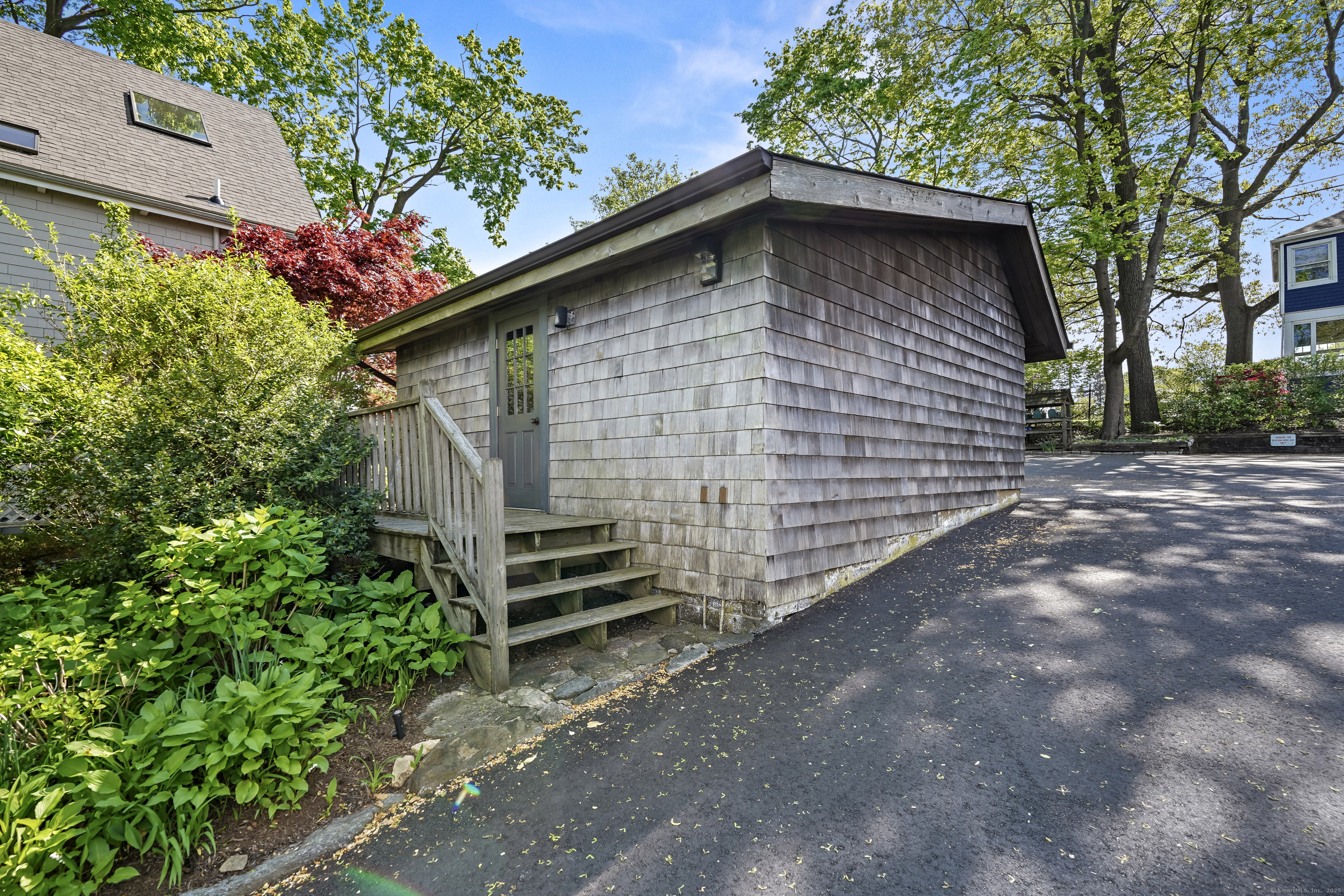 64 Ocean Drive East Stamford, CT 06902 - Photo 34 of 38 a pathway of a house with a yard