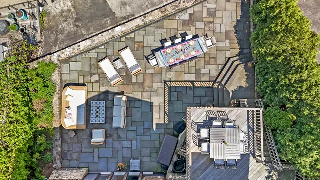 a living room with fireplace furniture and a large window