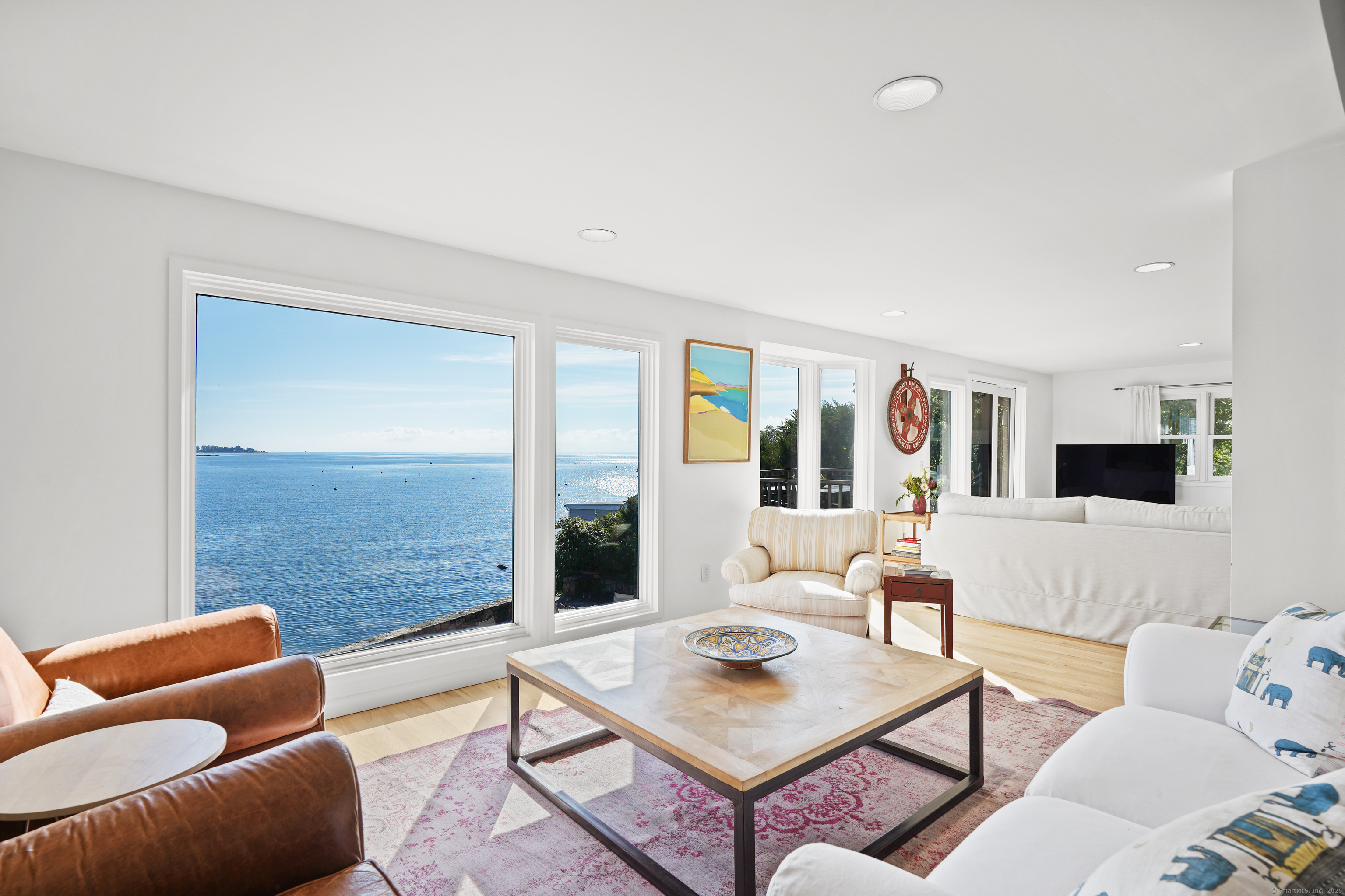 64 Ocean Drive East Stamford, CT 06902 - Photo 8 of 38 a living room with furniture and a large window