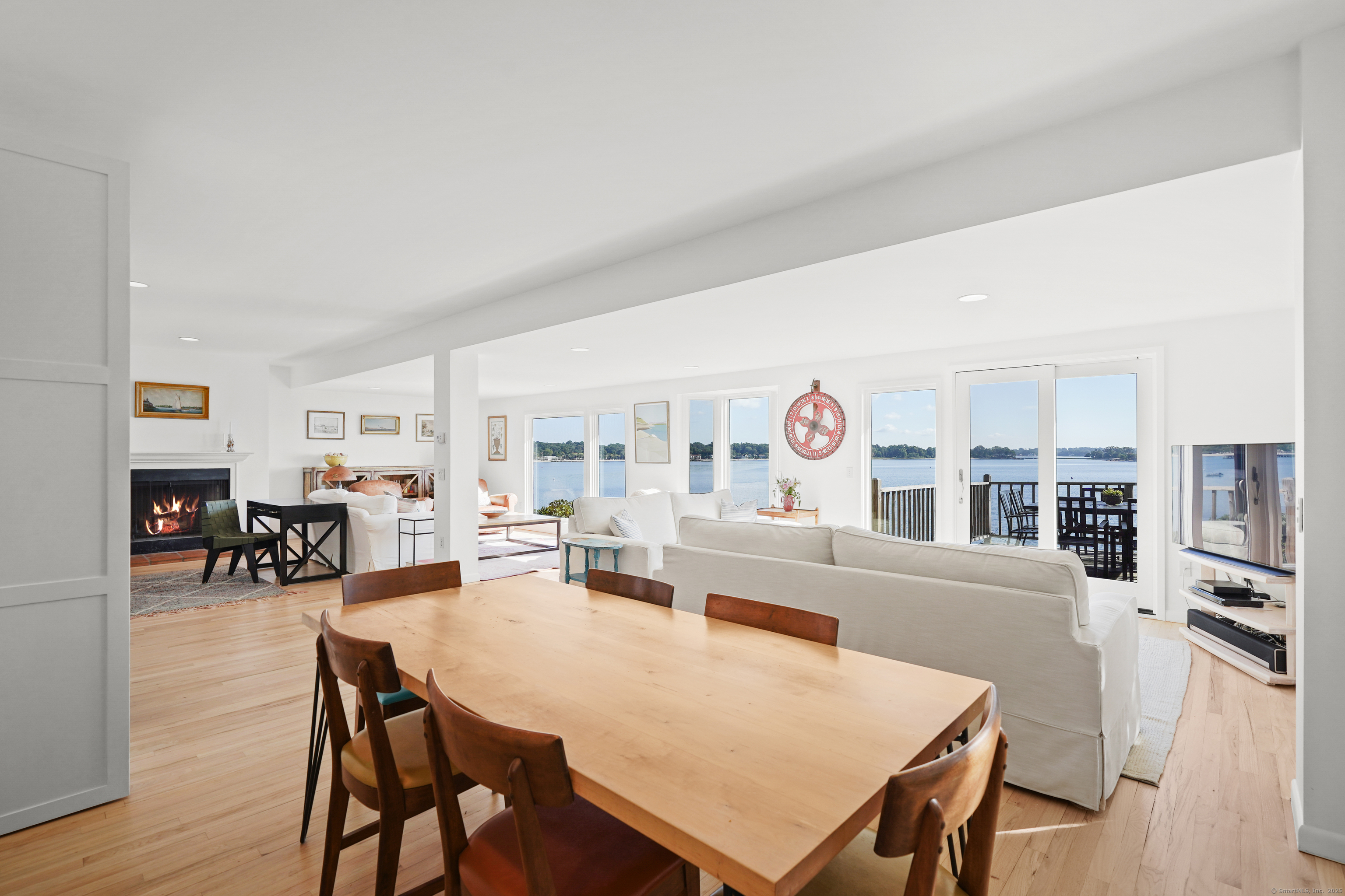 64 Ocean Drive East Stamford, CT 06902 - Photo 10 of 38 a living room with furniture a table and kitchen view