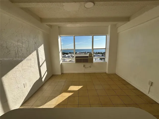 a view of a kitchen cabinets and wooden floor