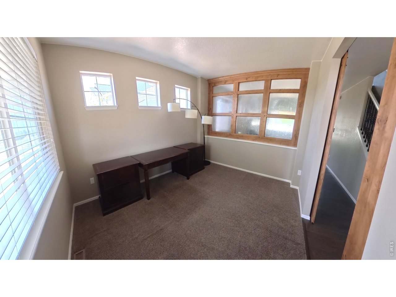 10434 Bluegrass Street Firestone, CO 80504 - Photo 4 of 26 Custom woodwork separates dinning and den area
