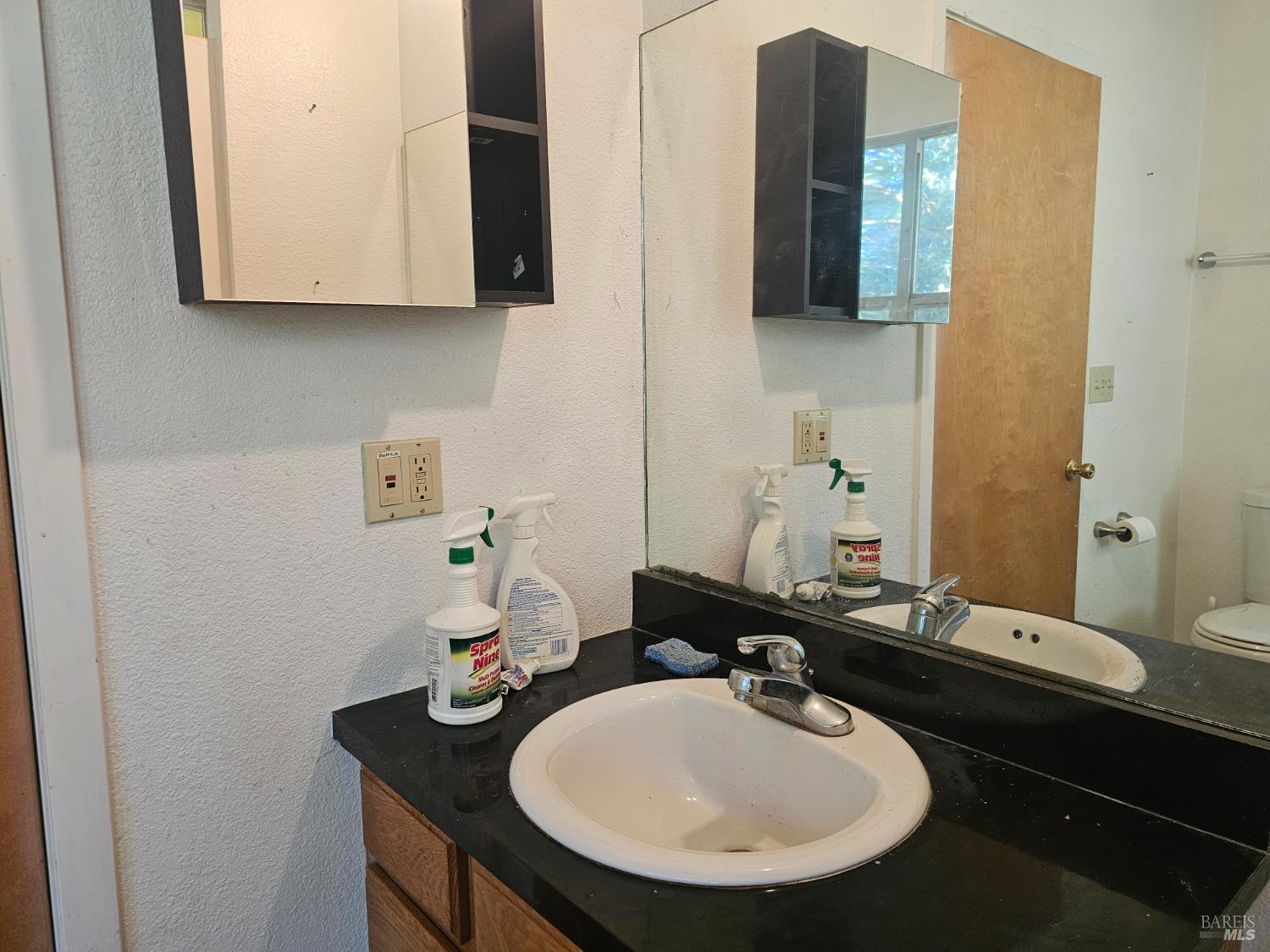 27651 Skyview Road Willits, CA 95490 - Photo 12 of 18 a bathroom with a sink and a mirror