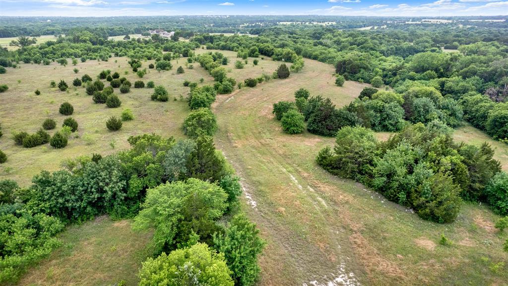 1415 South Joe Wilson Road Cedar Hill, TX 75104 - Photo 6 of 17 a view of a lake with mountains in the background