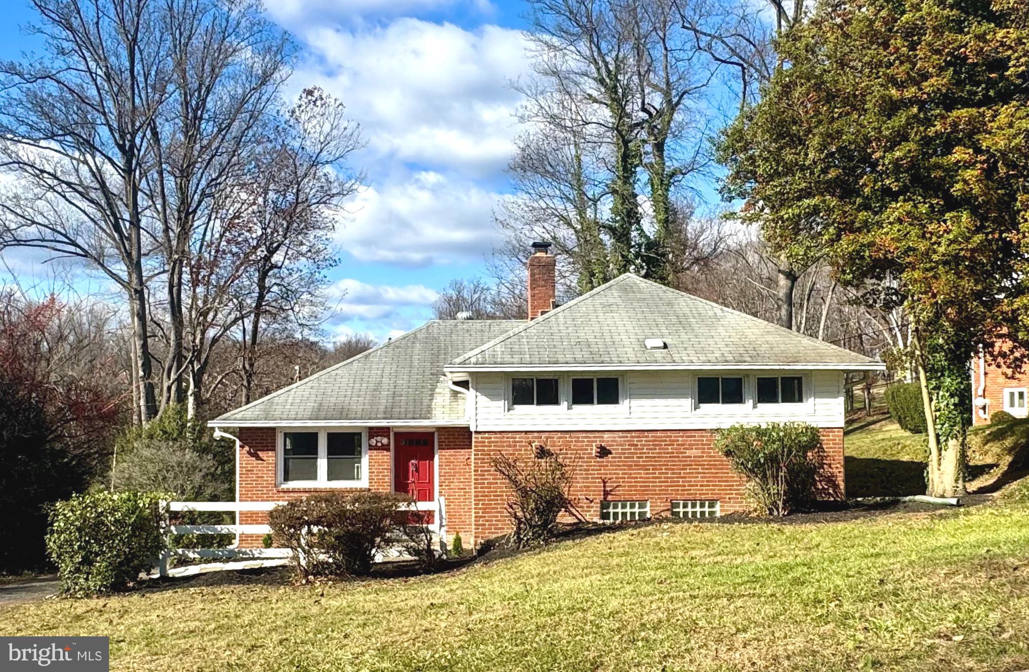 1204 St Andrews Way Baltimore, MD 21239 - Photo 13 of 15 a front view of a house with a yard