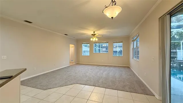 a view of a kitchen with a sink and a refrigerator