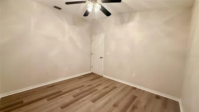 a view of a bathroom from a door