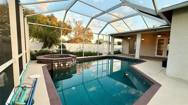 a view of swimming pool with seating area