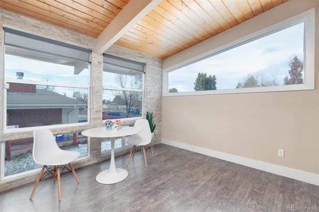 a view of a dining room with furniture window and outside view