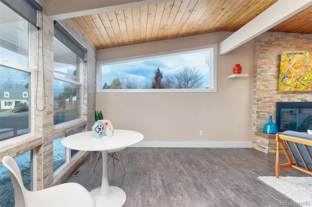 a view of a dining room with a table and chairs