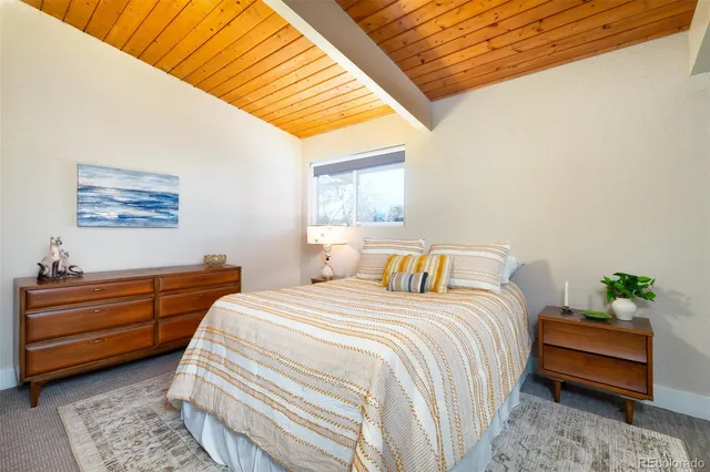 a bed room with a bed and a couch