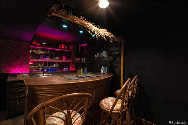 a view of a chairs and table in patio