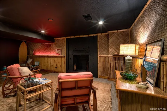 a room with gym equipment and a potted plant