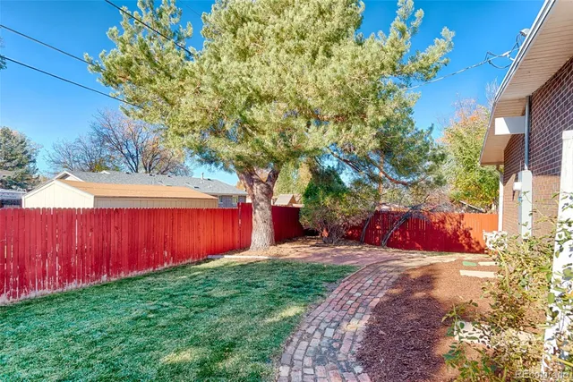 a view of a backyard with a small cabin
