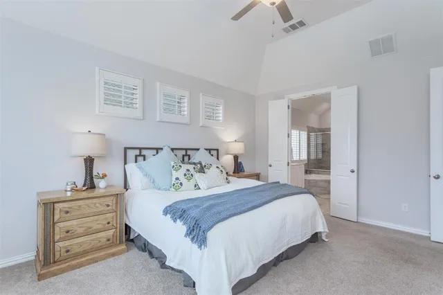 a bathroom with a bathtub shower sink and mirror