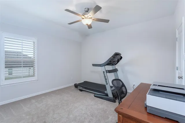 a bathroom with a granite countertop toilet a sink and a mirror
