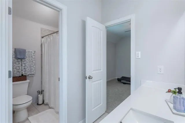 a bathroom with a sink vanity tub and shower