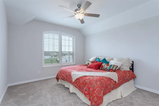 a dining room with furniture and a floor to ceiling window
