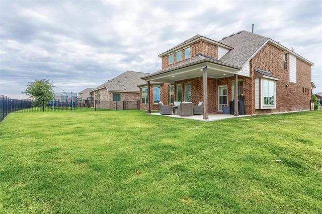 a house view with garden space and trees