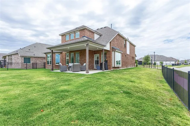 an aerial view of multiple house with outdoor space