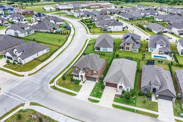 a view of a brick building with many windows