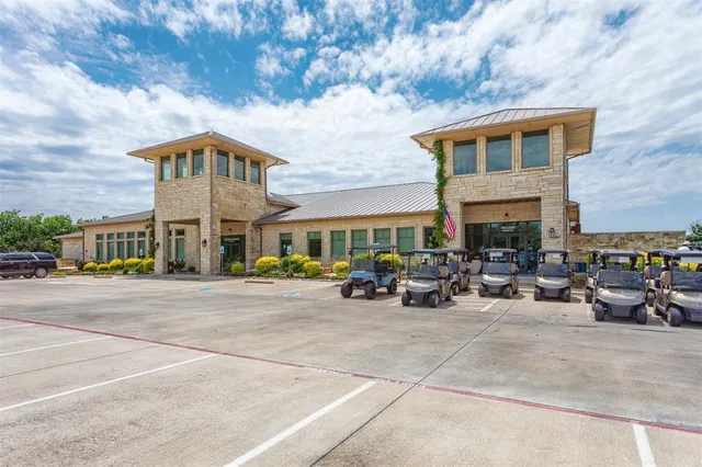 a view of a big house with a mountain in the background