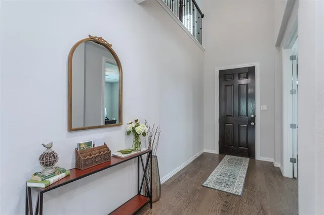 a room with painting and a table