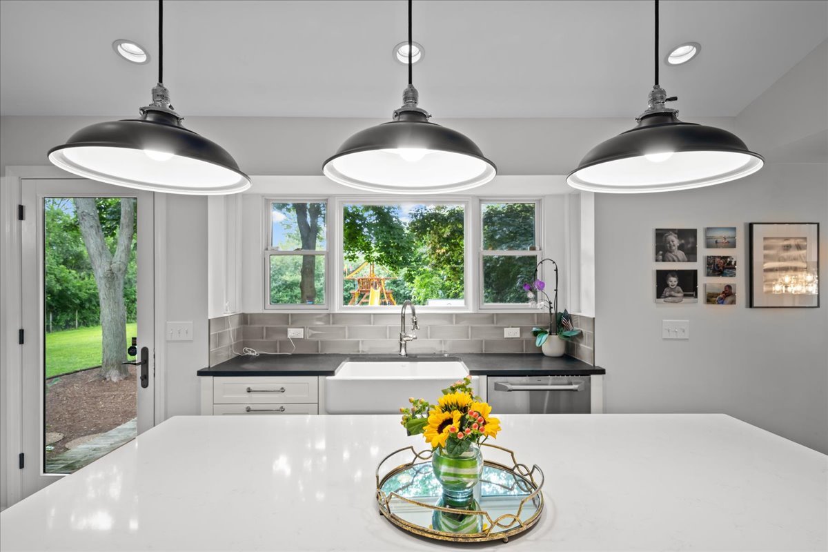 308 Signe Court Lake Bluff, IL 60044 - Photo 12 of 29 a kitchen with stainless steel appliances granite countertop a sink and a window