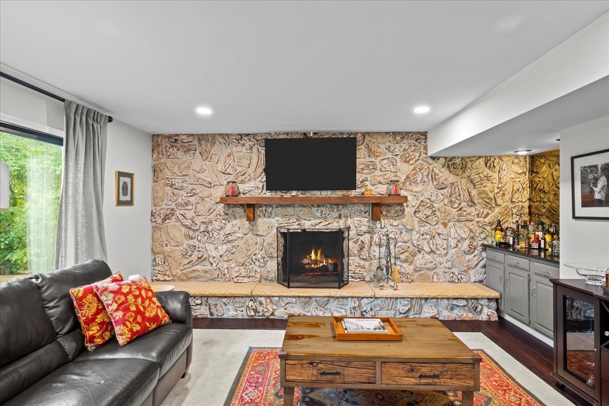 308 Signe Court Lake Bluff, IL 60044 - Photo 14 of 29 a living room with furniture a flat screen tv and a fireplace