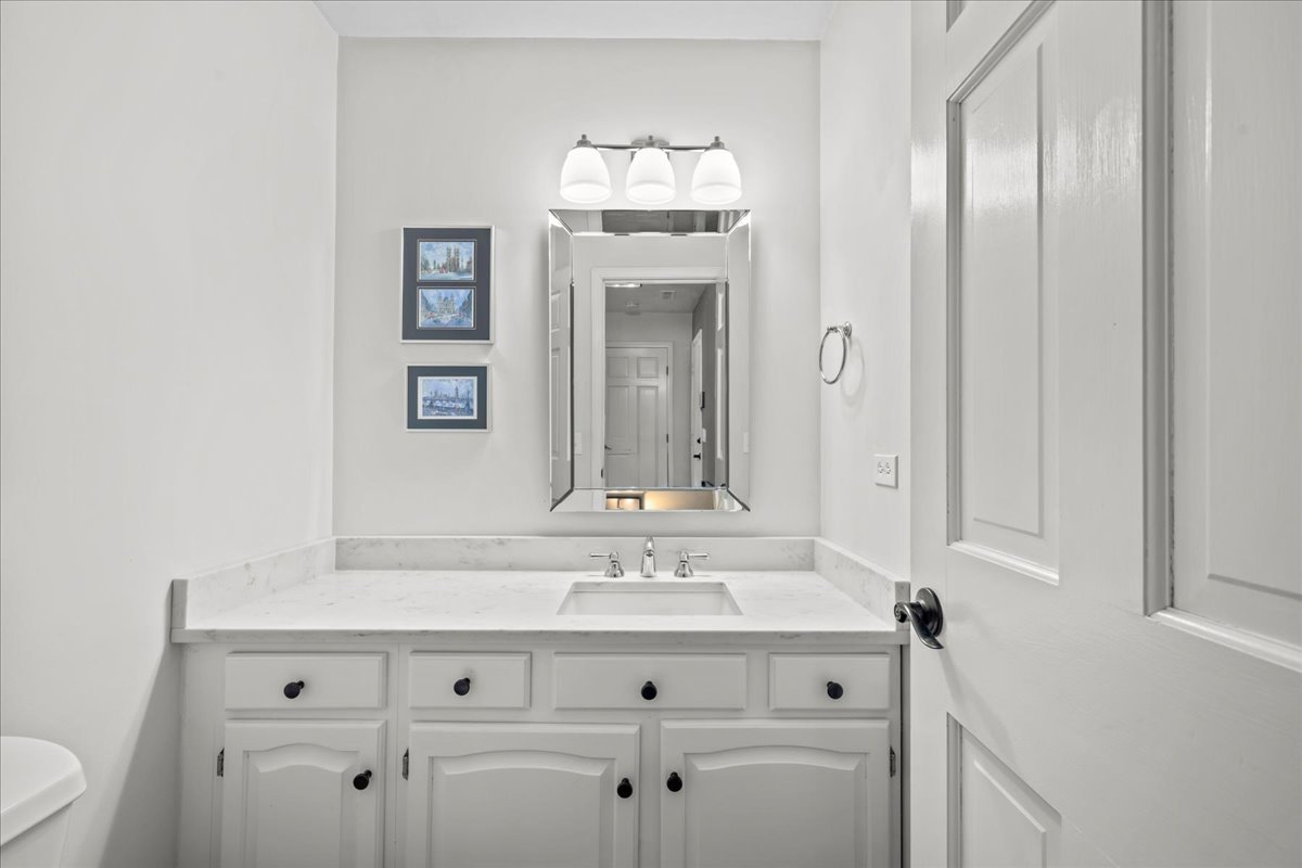 308 Signe Court Lake Bluff, IL 60044 - Photo 16 of 29 a bathroom with a sink and a mirror