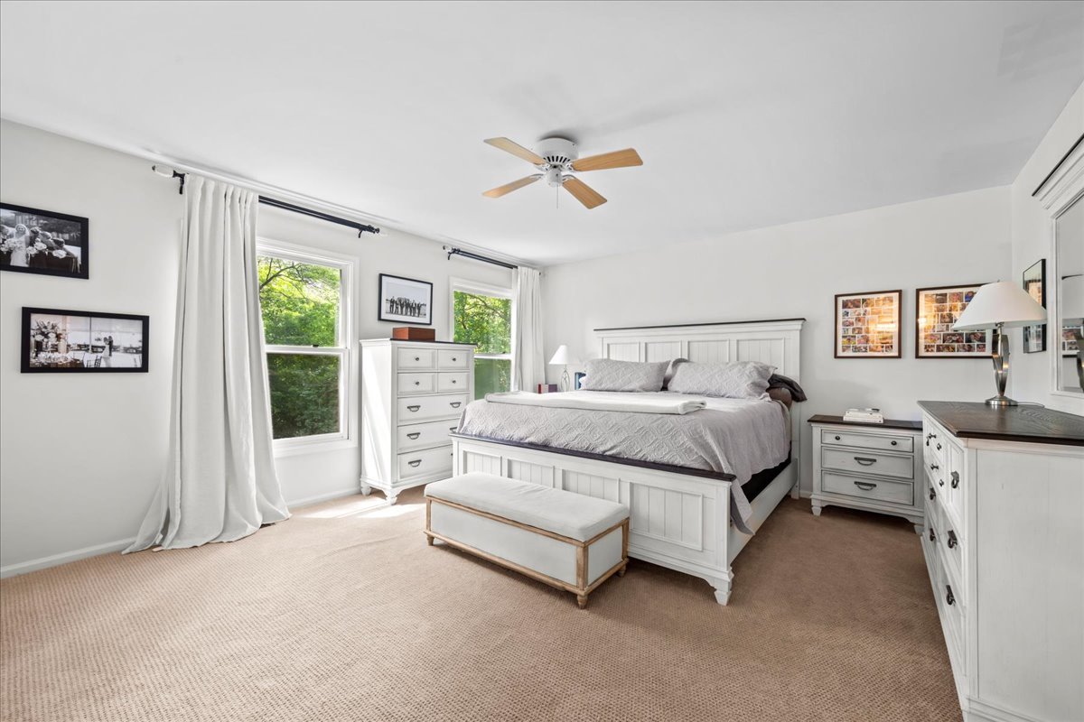 308 Signe Court Lake Bluff, IL 60044 - Photo 17 of 29 a bedroom with bed couch and window