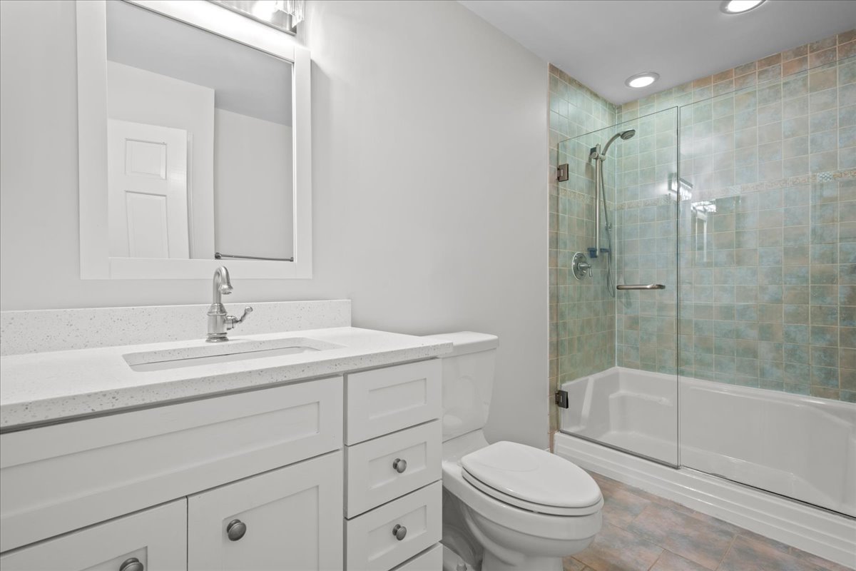 308 Signe Court Lake Bluff, IL 60044 - Photo 18 of 29 a bathroom with a sink a toilet and shower