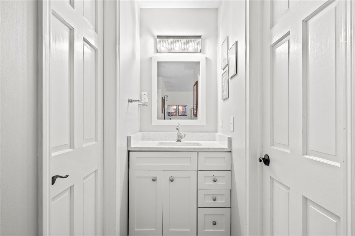308 Signe Court Lake Bluff, IL 60044 - Photo 19 of 29 a bathroom with a sink a mirror and a window