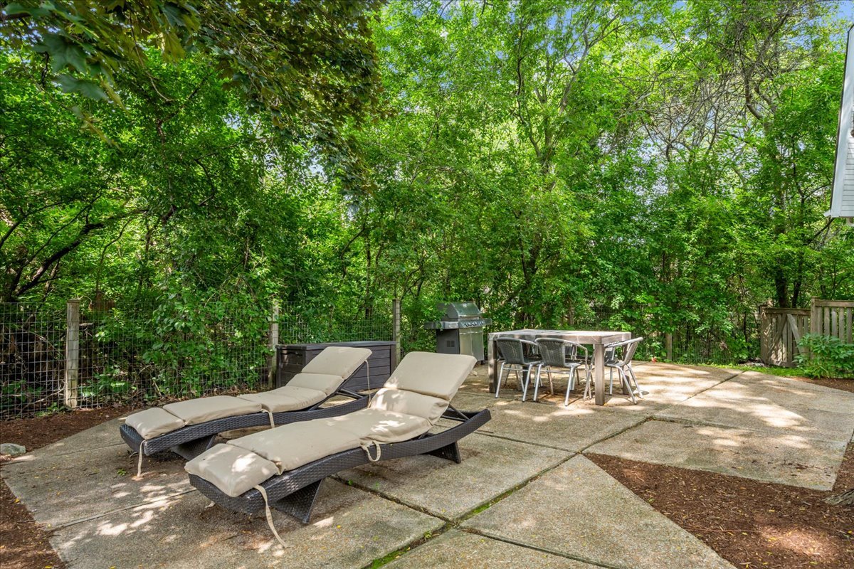 308 Signe Court Lake Bluff, IL 60044 - Photo 28 of 29 a view of a patio with table and chairs and wooden fence