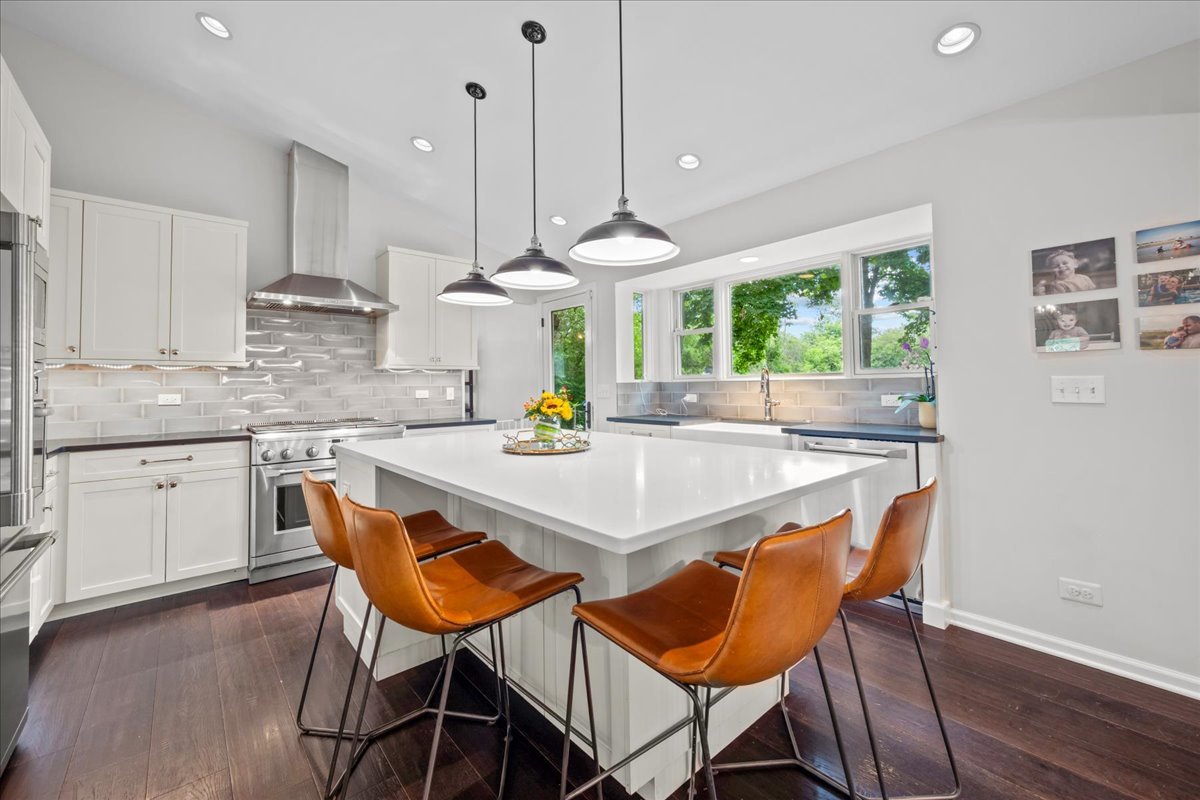 308 Signe Court Lake Bluff, IL 60044 - Photo 9 of 29 a kitchen with a dining table chairs and white cabinets