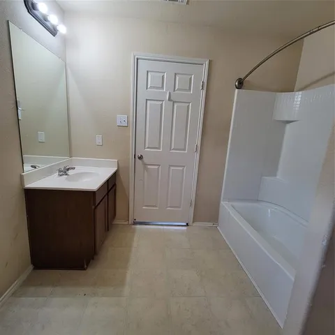 a bathroom with a toilet and a bathtub