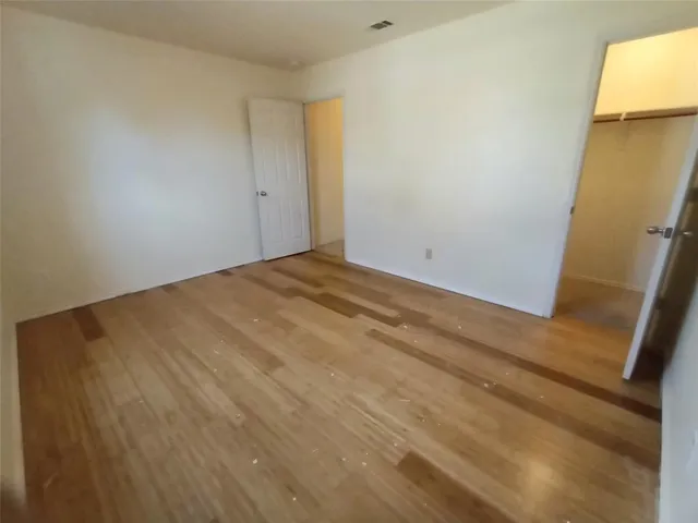a white toilet sitting next to a bath tub
