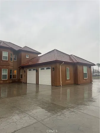 a front view of a house with yard