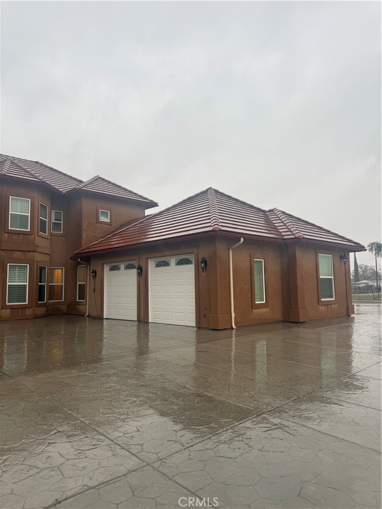 13372 Garland Street Madera, CA 93638 - Photo 2 of 2 a front view of a house with yard