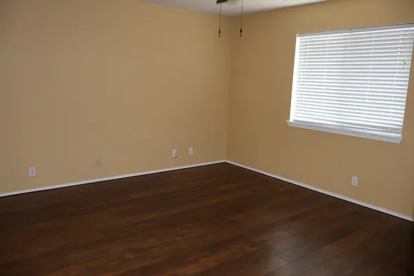 a white bath tub sitting next to a shower