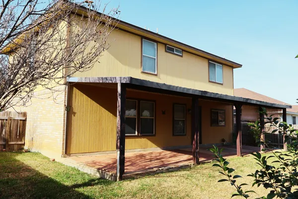 a house with trees in front of it